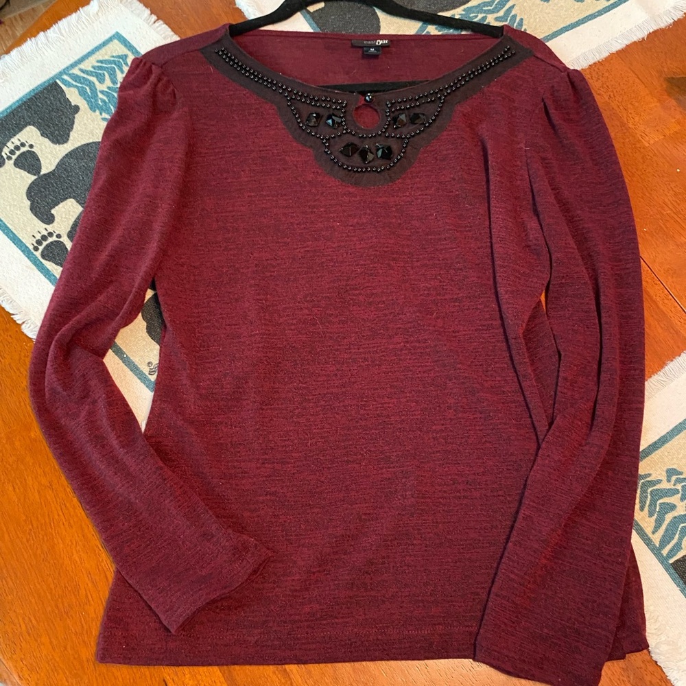Dressy polyester and spandex top with jeweled and beaded neckline, size M